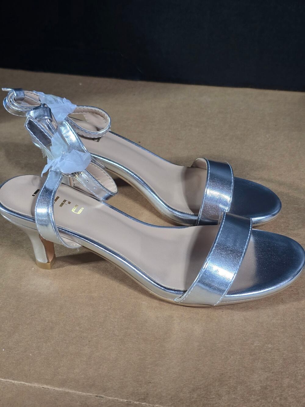 IDIFU mirror-finish metallic silver kitten heel sandals.